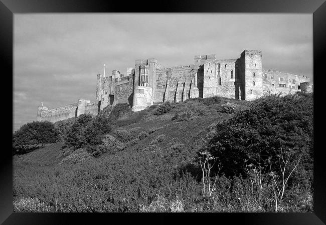 Bamburgh Castle Framed Print by Geoff Pickering