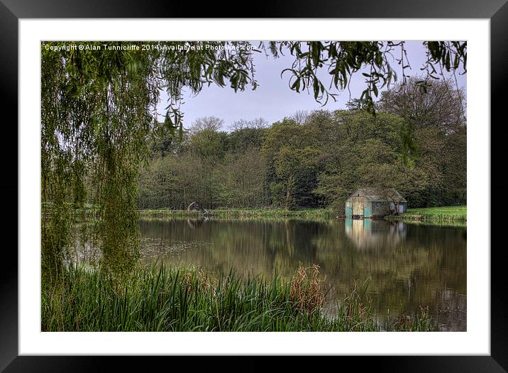 Tranquil angler at the old boathouse Framed Mounted Print by Alan Tunnicliffe
