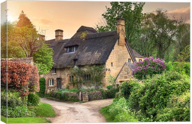 Cotswold cottage at sunset Canvas Print by Andrew Roland