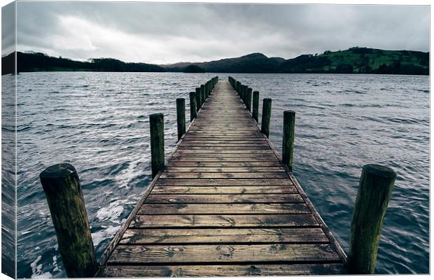Wooden jetty on Coniston Water. Canvas Print by Liam Grant