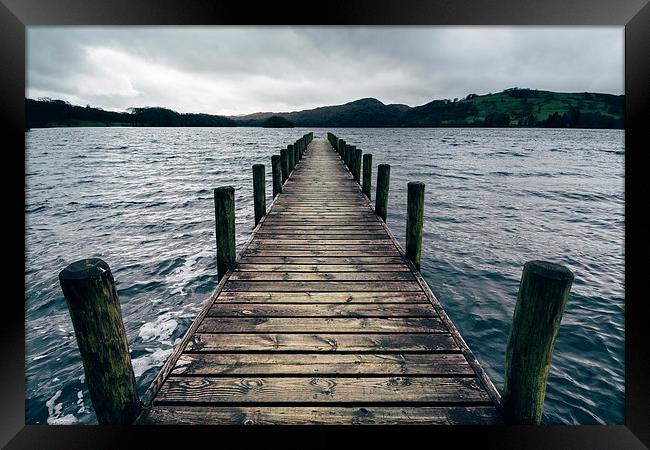 Wooden jetty on Coniston Water. Framed Print by Liam Grant