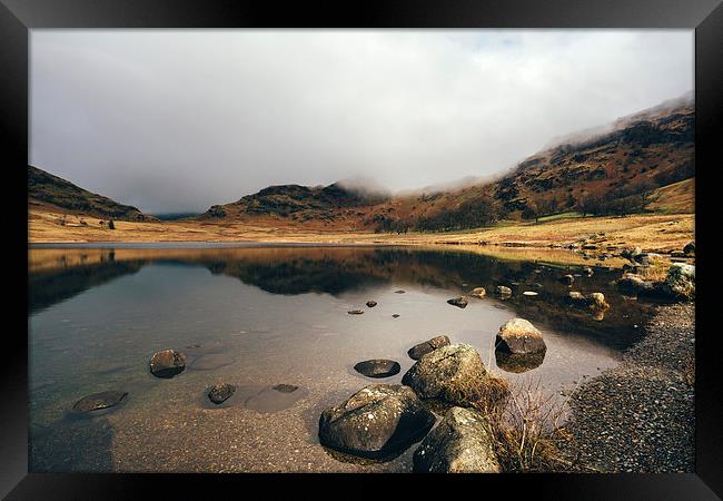 Low cloud and reflections on Blea Tarn. Framed Print by Liam Grant