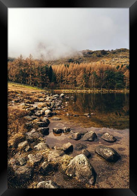 Low cloud and reflections on Blea Tarn. Framed Print by Liam Grant