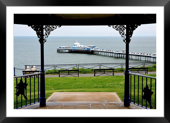 Picture of Llandudno Pier through the bandstand Framed Mounted Print by Frank Irwin