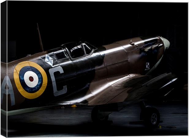 Spitfire in the shadows Canvas Print by Keith Campbell