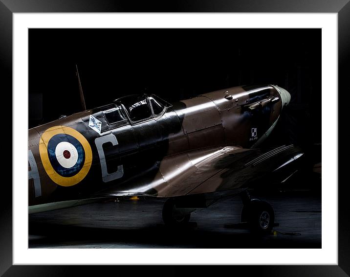 Spitfire in the shadows Framed Mounted Print by Keith Campbell