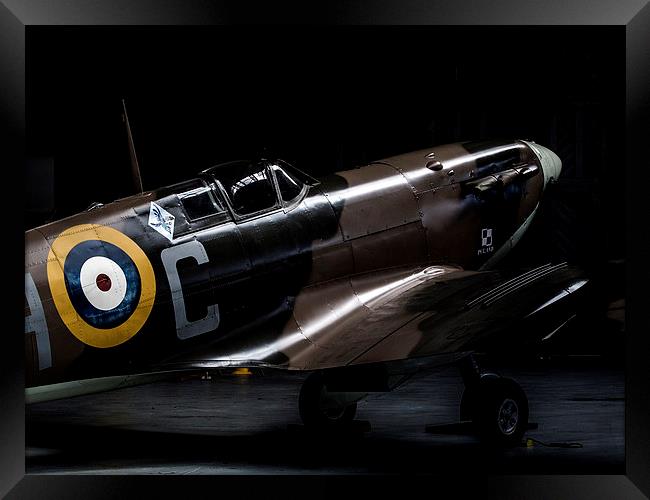 Spitfire in the shadows Framed Print by Keith Campbell