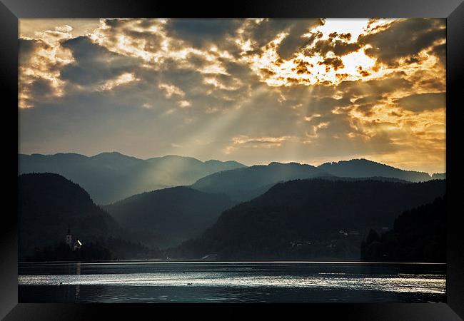 Angel rays over Lake Bled Framed Print by Ian Middleton
