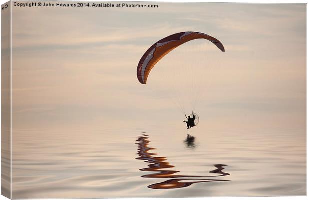 Powered paraglider Canvas Print by John Edwards