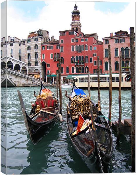 Gondolas near the Rialto Bridge in Venice Canvas Print by Linda More