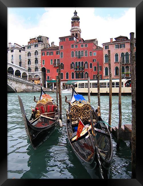 Gondolas near the Rialto Bridge in Venice Framed Print by Linda More