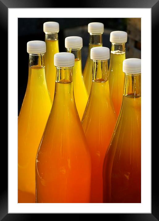 Apple juice in bottles Framed Mounted Print by Matthias Hauser
