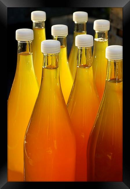 Apple juice in bottles Framed Print by Matthias Hauser