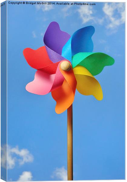 Pinwheel or Windmill Against a Blue Sky Canvas Print by Bridget McGill