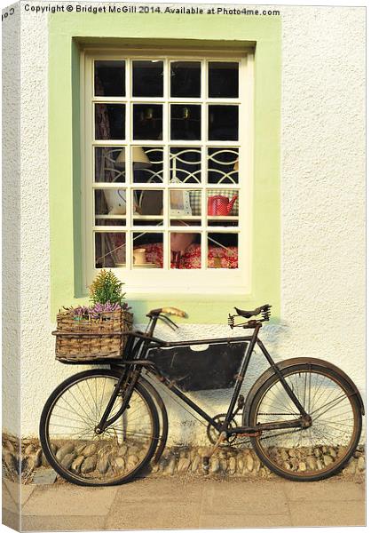 Bike Outside Old-Fashioned Shop Canvas Print by Bridget McGill