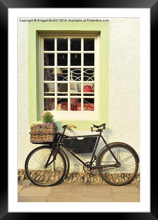 Bike Outside Old-Fashioned Shop Framed Mounted Print by Bridget McGill
