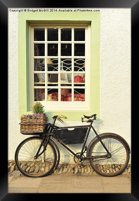 Bike Outside Old-Fashioned Shop Framed Print by Bridget McGill