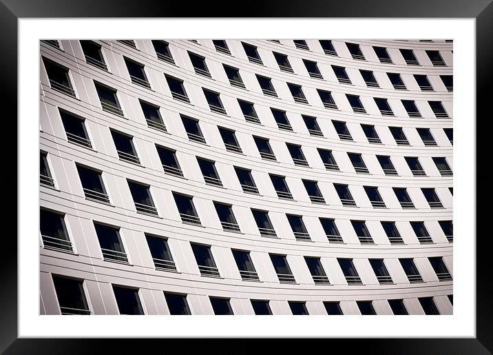 Windows on a curved building Framed Mounted Print by David Clark