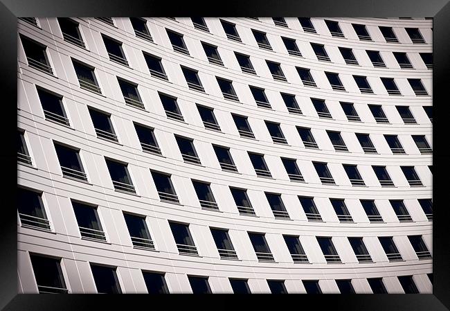 Windows on a curved building Framed Print by David Clark