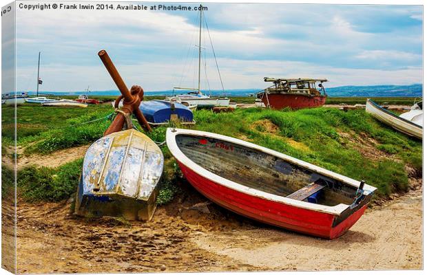 A row of small boats beached awaiting the incoming Canvas Print by Frank Irwin