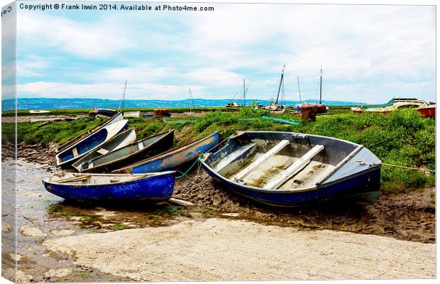A row of small boats beached awaiting the incoming Canvas Print by Frank Irwin