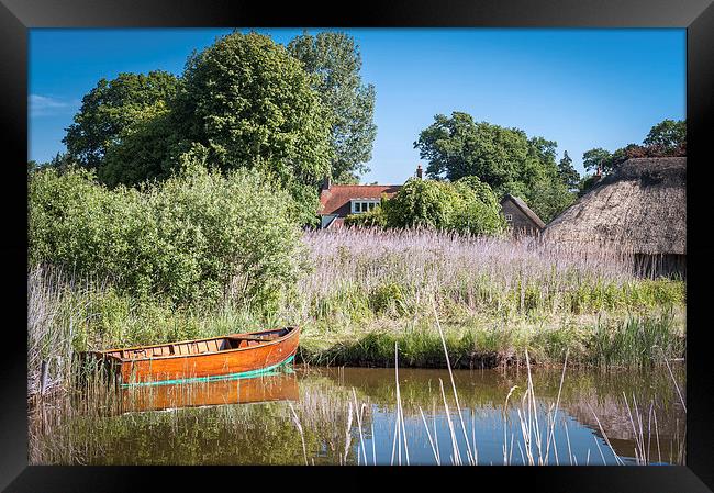 Wooden Dinghy on Hickling Broad Framed Print by Stephen Mole