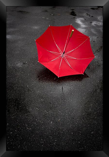 Red umbrella in the rain Framed Print by Edward Fielding