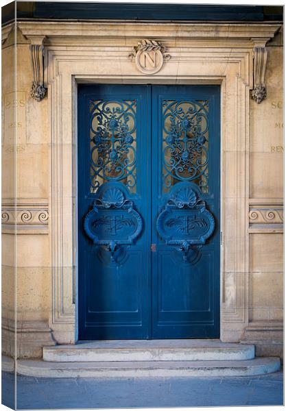 Parisian Blue Door Canvas Print by Brian Jannsen