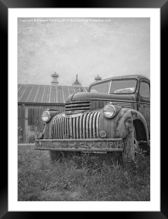 Old farm truck out by the barn Framed Mounted Print by Edward Fielding