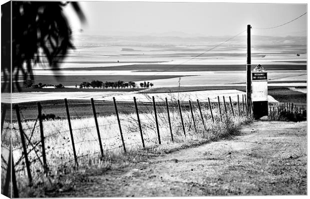 Lonely country road Canvas Print by Jose Manuel Espigares Garc