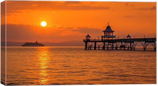 Sun setting at Clevedon Pier. Canvas Print by Dean Merry