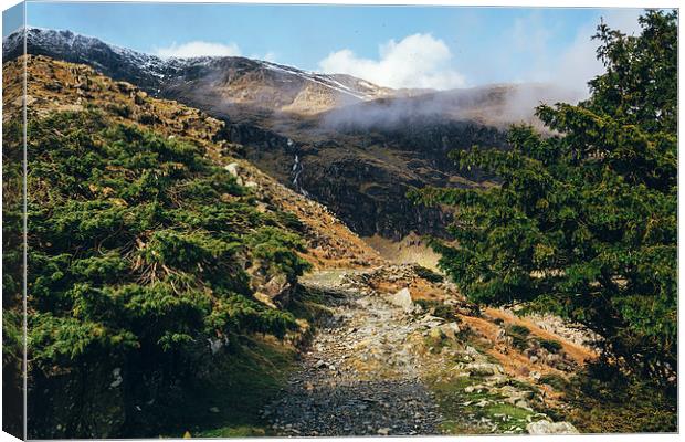 Mountain footpath and distant waterfall near Conis Canvas Print by Liam Grant