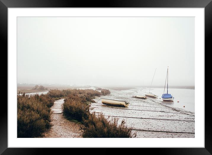 Boats moored at Blakeney in fog. Framed Mounted Print by Liam Grant