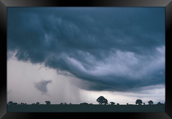 Evening thunder storm and clouds over rural scene. Framed Print by Liam Grant