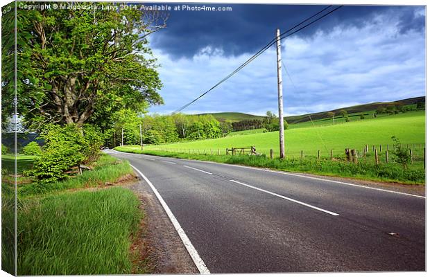 An empty road in the countryside of Scotland Canvas Print by Malgorzata Larys