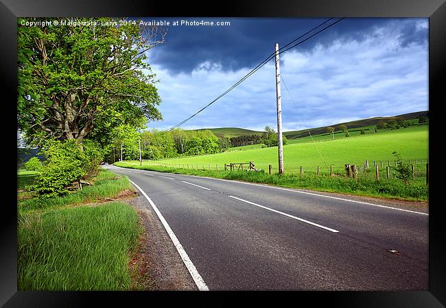 An empty road in the countryside of Scotland Framed Print by Malgorzata Larys