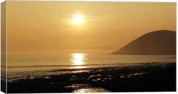 Sunset over Manorbier Bay Canvas Print by Mandy Llewellyn