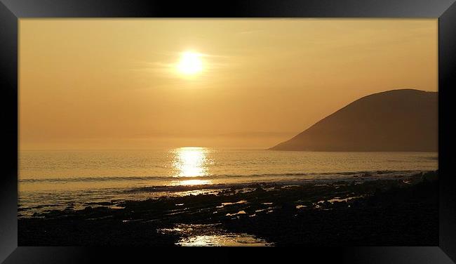 Sunset over Manorbier Bay Framed Print by Mandy Llewellyn