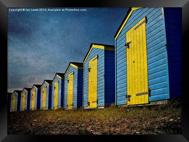  Blue and Yellow Beach Huts Framed Print by Ian Lewis