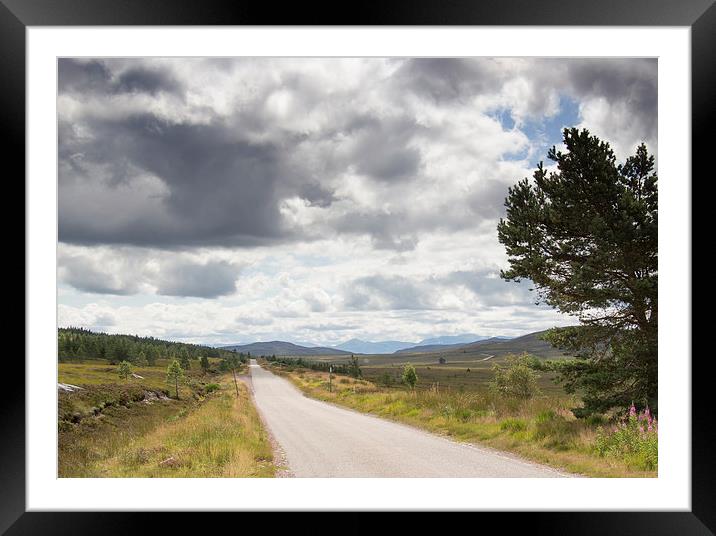  Clouds above remote Highland Road Framed Mounted Print by Derek Corner