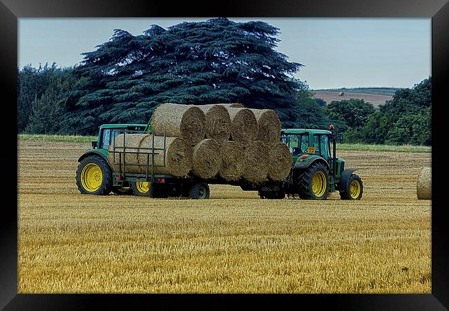  Gathering the hay bales Framed Print by Dean Messenger