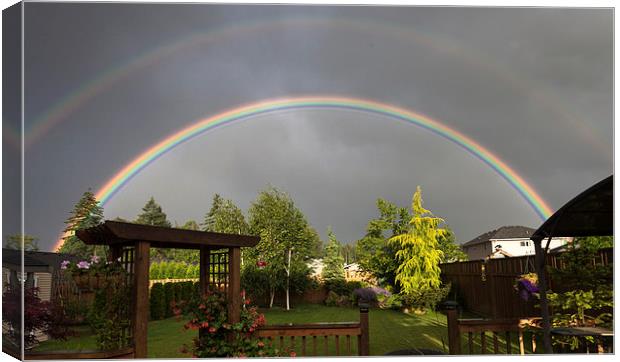 Double rainbow over garden Canvas Print by Leighton Collins