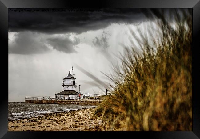  Low Lighthouse ahead of Storm Framed Print by matthew  mallett