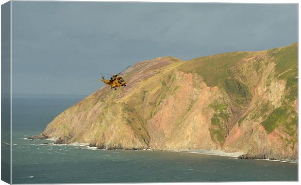 Rescue Helicopter over Lynmouth Bay  Canvas Print by graham young
