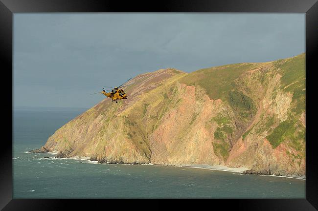 Rescue Helicopter over Lynmouth Bay  Framed Print by graham young