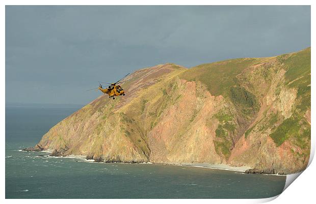 Rescue Helicopter over Lynmouth Bay  Print by graham young