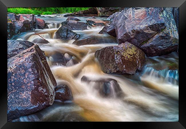Cascading water over rocks Framed Print by Jonah Anderson Photography