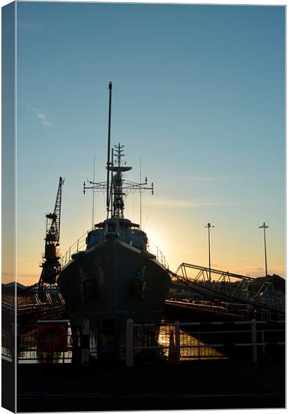 Setting sun Behind HMS Cavalier  Canvas Print by Mike Gwilliams
