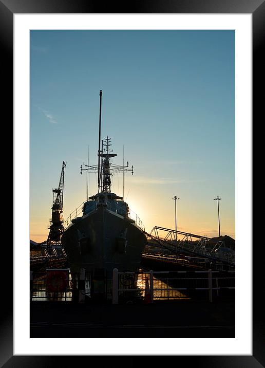 Setting sun Behind HMS Cavalier  Framed Mounted Print by Mike Gwilliams