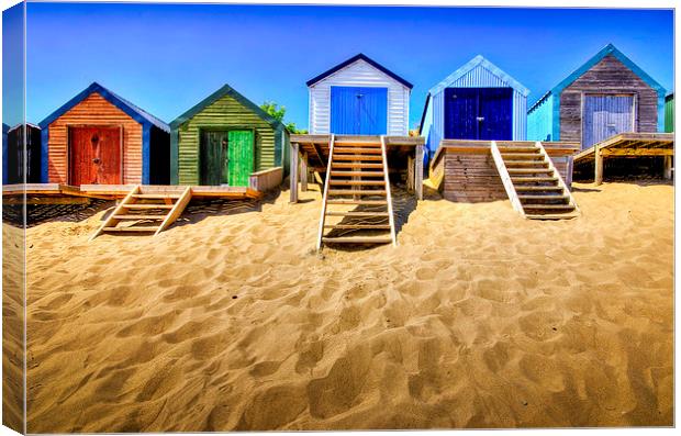 Vibrant Haven: Abersoch Beach Huts Canvas Print by Mike Shields